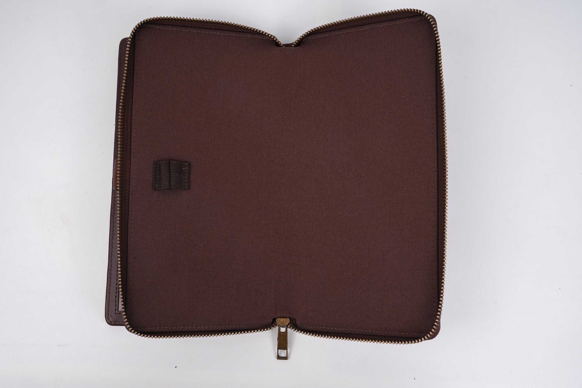 Brown zippered pouch on a white background