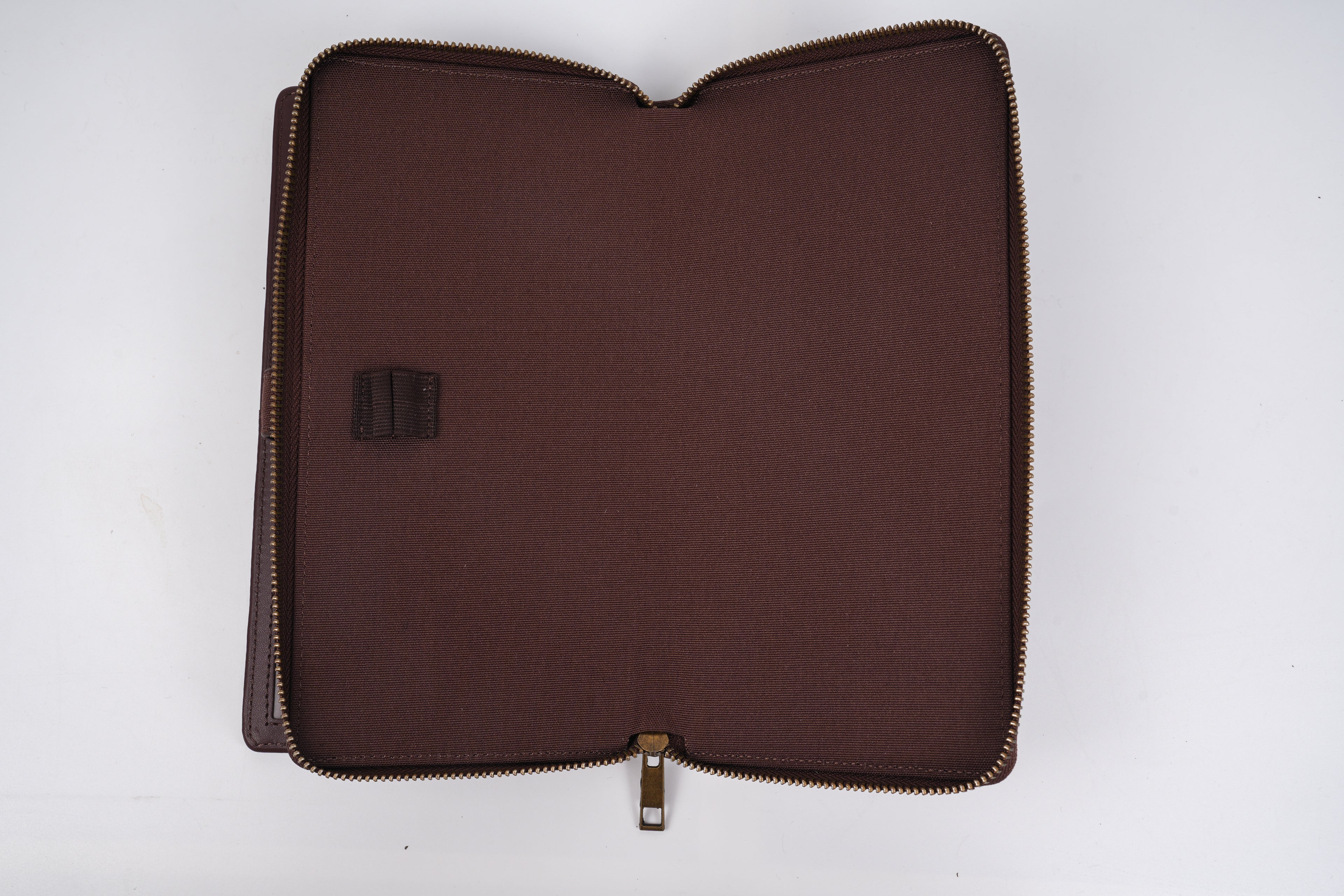 Brown zippered pouch on a white background