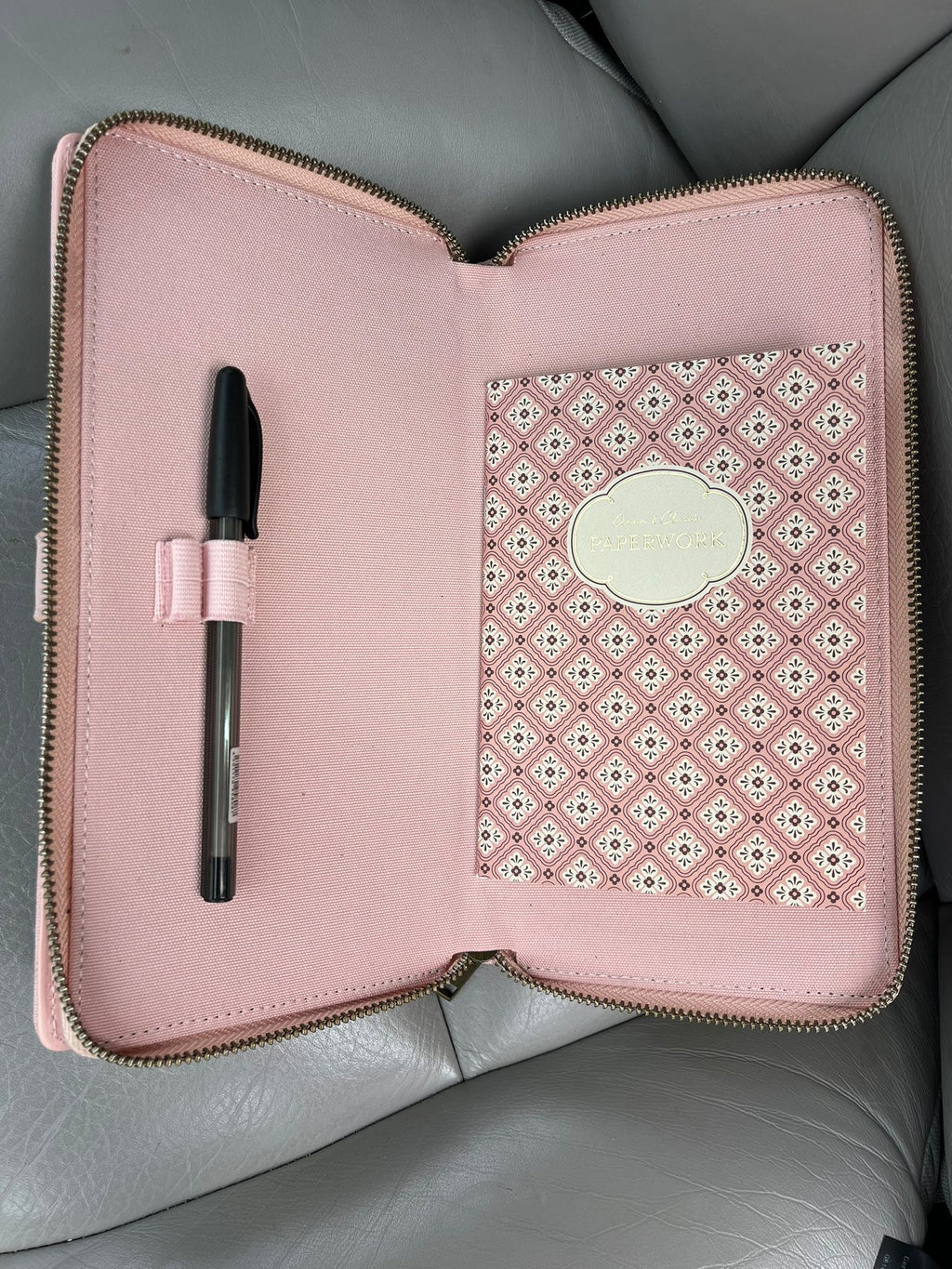 Pink car document holder open