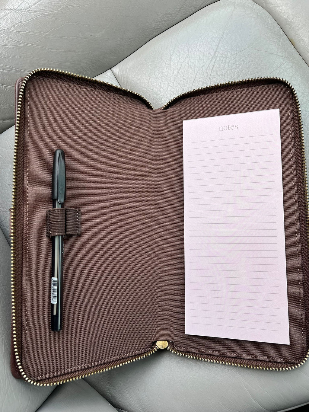 Brown car document holder open