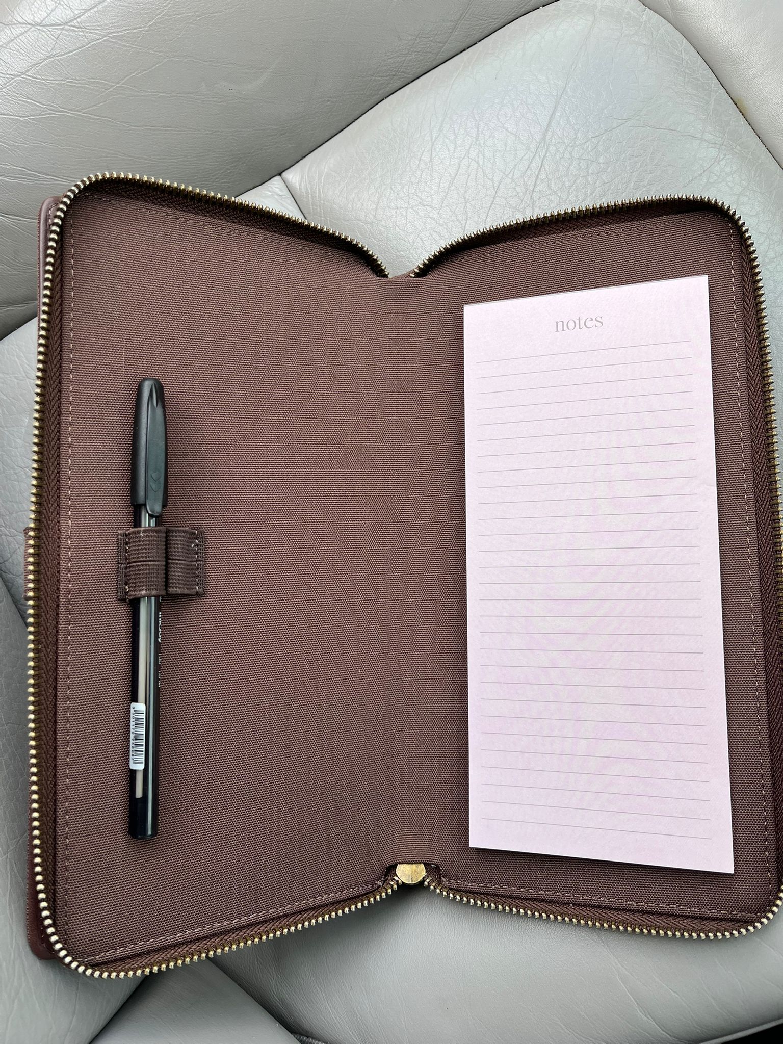 Brown car document holder open